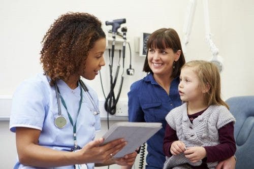 A nurse consults with patients. ANCC and AANP certifications can help nurse practitioners advance in their careers.