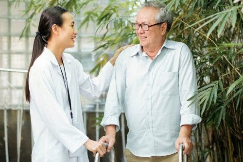 A nurse talks with an elderly patient.