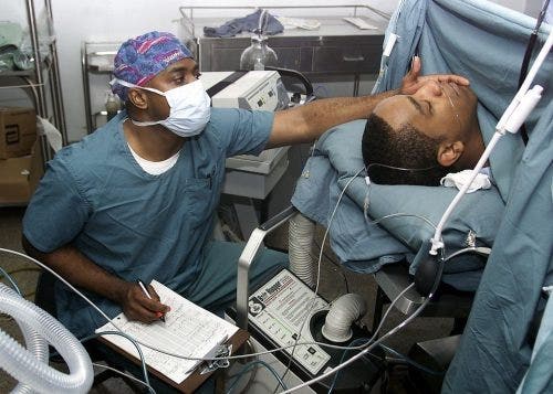 Nurse in surgery taking notes