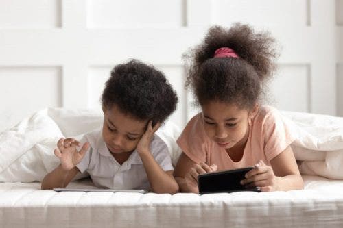 Children watching videos on tablets.