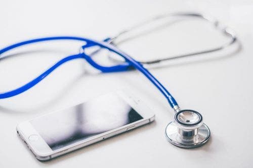 stethoscope and phone on table