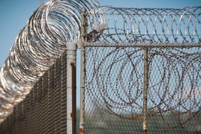 barbed wire around prison fence