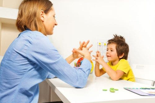 ABA therapist works with a child diagnosed with autism