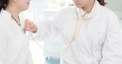 Nurse performing clinical chest examination