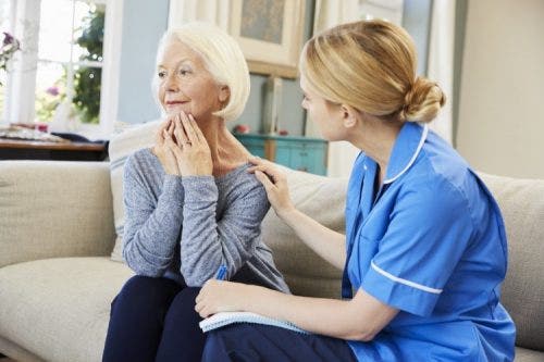 A nurse works with a mental health patient.