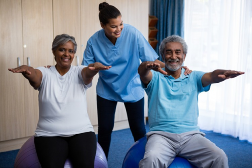 A nurse teaching her patients yoga.