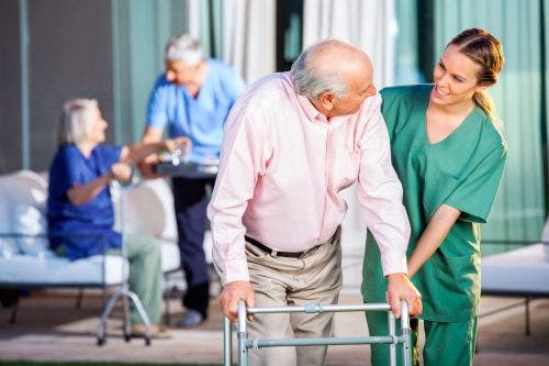 Nurse helping elderly patient