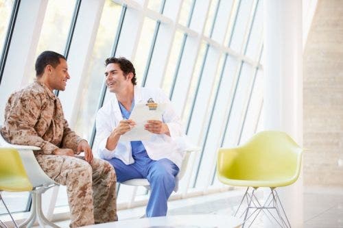 A nurse counsels a patient.