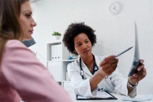 A nurse explains test results to a patient.