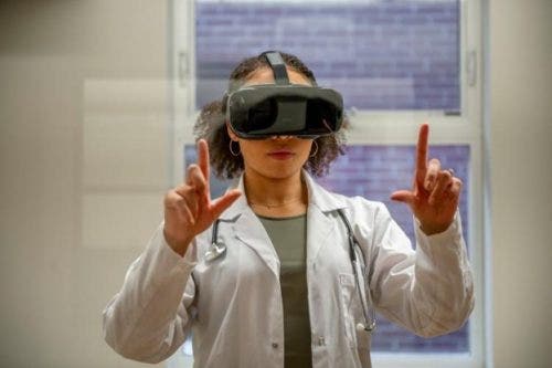 A nurse uses a virtual reality headset.