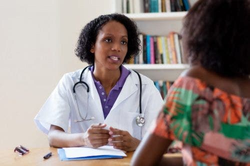 A nurse consults with a mental health patient.