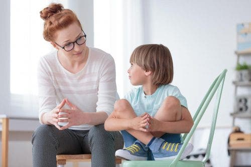 ABA therapist works with a child who has been disruptive.