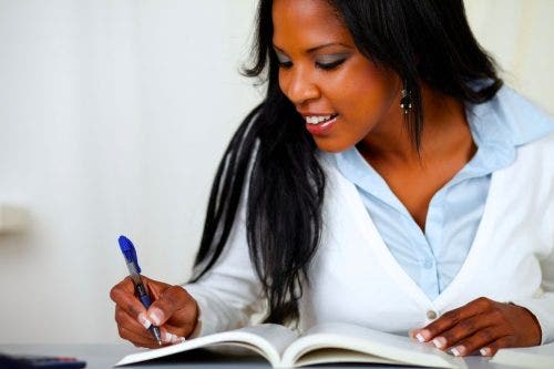 Young lady sitting at a desk studying