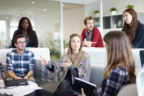 a group of young professionals having a discussion