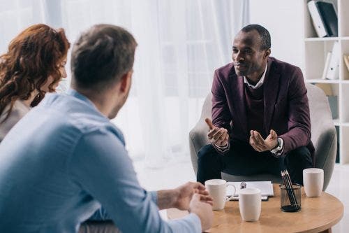 Male substance abuse nurse counsels patients suffering with drug addiction.