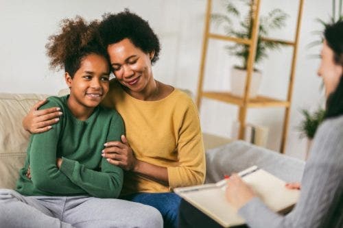 A mother and daughter attend a therapy session with a psychiatric nurse practitioner.