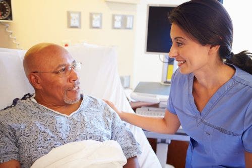 : Friendly-conversation-about-care-between-nurse-and-patient-builds-trust-and-is-an-example-of-patient-advocacy-in-nursing.