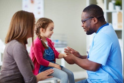 A family nurse practitioner meets with his patients.